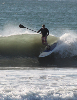 Carl Mahlstedt surfing on a stand up paddleboard