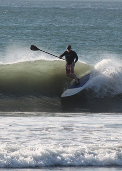 Carl Mahlstedt surfing on a stand up paddleboard