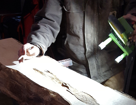 Photo of checking sanding with a low angle light