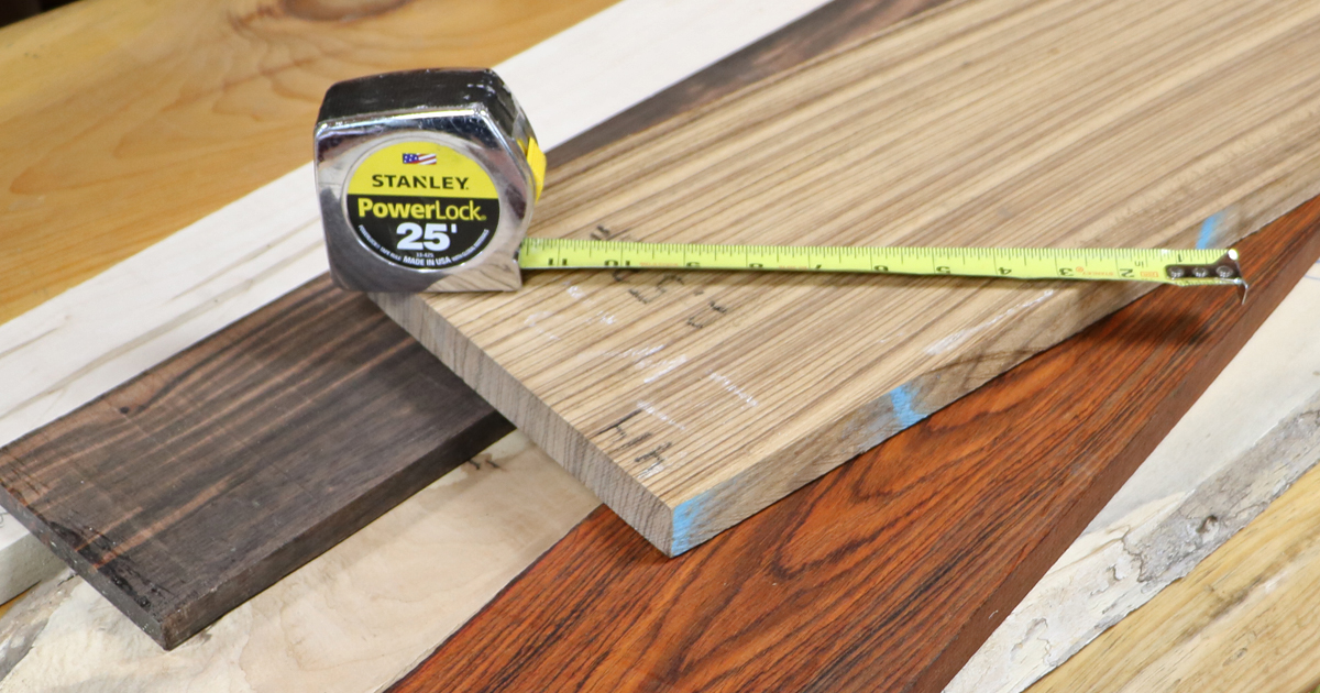 Phote of Tape Measure on a variety of exotic woods