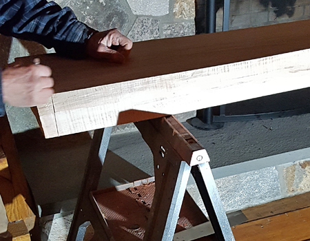 Photo of marking a mantle's length with a pencil