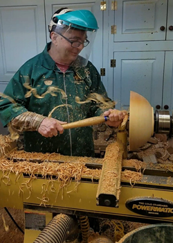 Photo of Claude Dupuis at the lathe