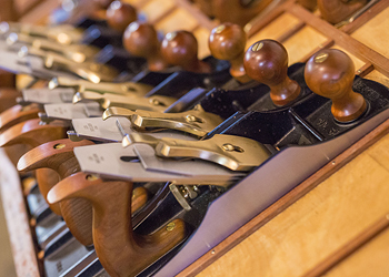 Close up photo of a line of Lie-Nielsen Hand Planes