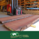 Photo of two mahogany slabs in lumber warehouse.