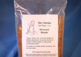Photo of a bag of dewaxed blond shellac flakes